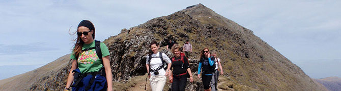 A small group of walkers descending the South Ridge, Mount Snowdon